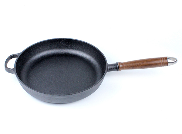 cast iron frying pan with wooden handle