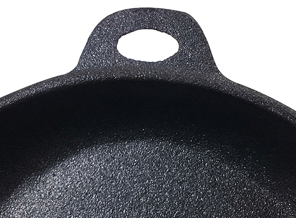 cast iron frying pan with long wooden handle