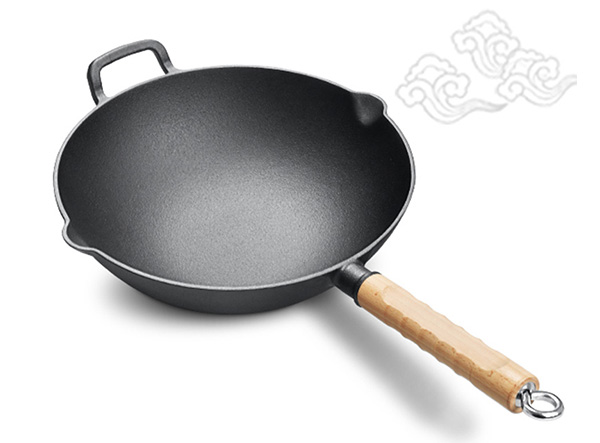 large wok with wooden handle